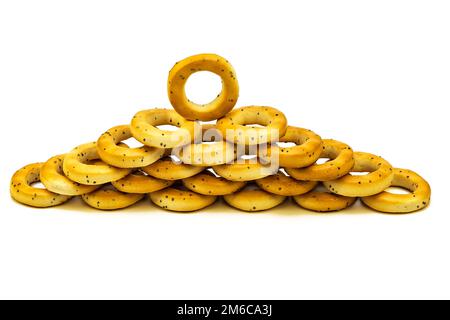 Poppy bagels stacked on top of each other on a white background Stock Photo