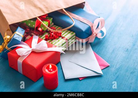 Gift bag overturned on the table Stock Photo