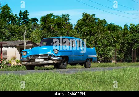 American blue classic car on the highway in Matanzas to Varadero in Cuba Stock Photo