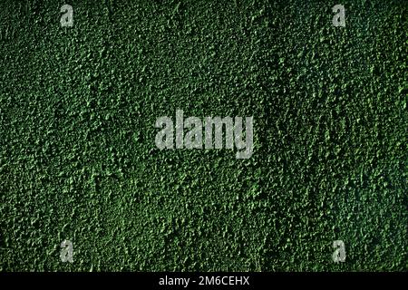 Green rough wall. Painted surface. Roughness texture. Stock Photo