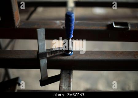 Metal processing in garage. Steel billet in garage. Stock Photo