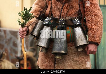 Traditional Kukeri costume bells on a traditional Bulgarian Kukeri holidays festival Stock Photo