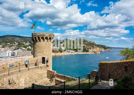 Tower with a wall of an old fortress and the coast of Tossa de Mar (Spain) Stock Photo