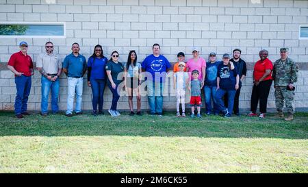 Volunteers stand for a photo during an Earth Day clean-up event at Barksdale Air Force Base, Louisiana, April 22, 2022. Volunteers visited every playground on the East Reservation Housing Area, cleaning up loose trash to promote base cleanliness and environmental responsibility. Stock Photo