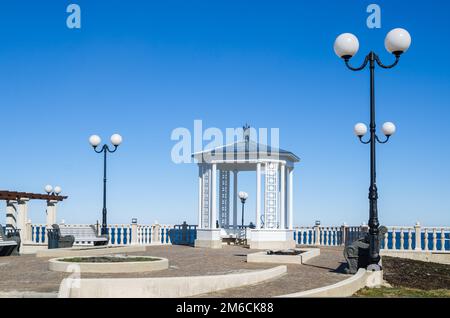 A beautiful romantic gazebo in the park on blue sky background Stock Photo