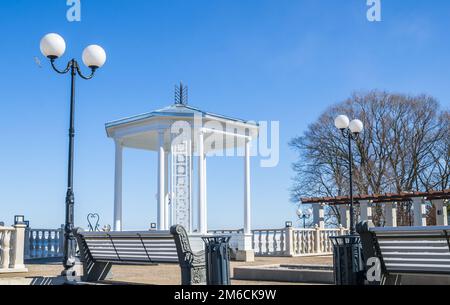 A beautiful romantic gazebo in the park on blue sky background Stock Photo