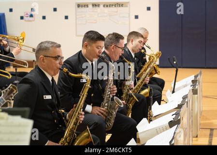 220422-N-SJ665-1015 SPRINGFIELD, Va. (April 22, 2022) The saxophone section of the United States Navy Band Commodores perform during a Music in the Schools concert for students at Cardinal Forest Elementary School.  Music in the Schools is an educational outreach program developed by the Navy Band which reaches diverse audiences in the Washington, D.C. region. Stock Photo