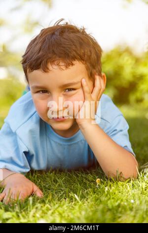 Child little boy thinking looking outside portrait format Stock Photo