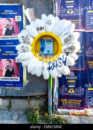 Old street pay phone booth in the form of a sunflower, Kadikoy, Istanbul, Turkey Stock Photo