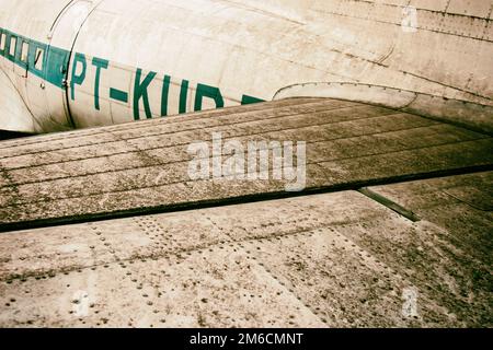 Background of rear wing of old metal plane. Stock Photo