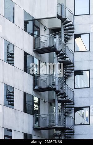 picture of a spiral staircase in the corner of an office building Stock Photo