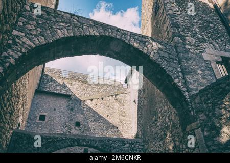 Low angle view of castle arches and walls from an inside courtyard. Stock Photo