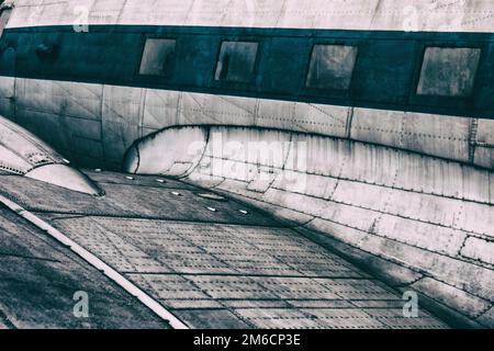 Background of wing and cabin of classic metal plane. Stock Photo