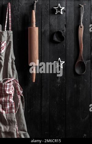 Kitchen tools on wooden wall Stock Photo