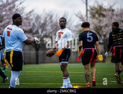 Participants from Team Misawa play flag football during the first-ever Sakura Olympics at Misawa Air Base, Japan, April 22, 2022. The Sakura Olympics gets its name from the famous cherry blossom tree. Throughout history, the Japanese government has given numerous cherry blossom trees to the U.S. government, symbolizing the bond between the two nations. Stock Photo