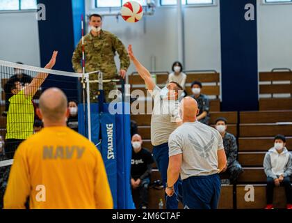 Participants from Team Misawa play volleyball during the first-ever Sakura Olympics at Misawa Air Base, Japan, April 22, 2022. The Sakura Olympics gets its name from the famous cherry blossom tree. Throughout history, the Japanese government has given numerous cherry blossom trees to the U.S. government, symbolizing the bond between the two nations. Stock Photo