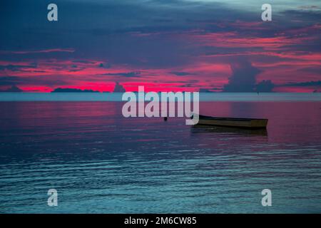 Colorful sunset over the sea. Dark dramatic sky Stock Photo