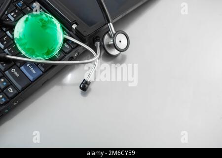 Glass globe and stethoscope Stock Photo