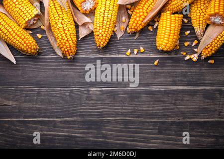 Corn Cobs On Wooden Table Stock Photo