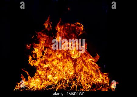 Flame fires. Burn lights on a black background. Fire flames on black background. Abstract fire flame background. Stock Photo