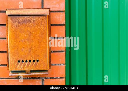 A beautiful mailbox hangs waiting for newspapers, parcels and letters. Stock Photo