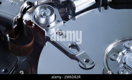 Macro of a hard disk and its read/write head Stock Photo