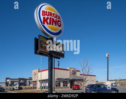 Burger King fast food restaurant with signage featuring its Impossible Whopper, a plant-based meat alternative to its signature Whopper burger. (USA) Stock Photo