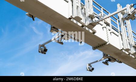 Close-up Of Security Camera On The Street. Multi-angle CCTV on pillar 360 degree system background blast cipping path operating over the road monitoring system of blue sky. Technology concept Stock Photo