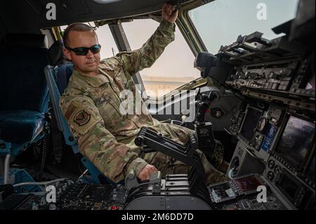 U.S. Air Force Tech. Sgt. Richard Shifflett, C-17 avionics technician, 5th Expeditionary Air Mobility Squadron, applies the brakes on a C-17 Globemaster III aircraft for a maintenance check at Ali Al Salem Air Base, Kuwait, April 24, 2022. From May 2021 to May 2022, the 5th EAMS supported 1,300 missions, 19,600 cargo tons, and 8,800 passengers at Ali Al Salem Air Base. Stock Photo