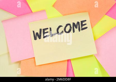 Welcome new employee colleague refugees refugee immigrants note paper Stock Photo