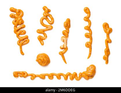 Spicy Mustard Splashes Isolated On White Background Stock Photo