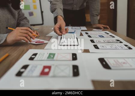 Young Asian Start up new business working at creative office. Modern start-up business team. Co-workers ui, ux startup small business Stock Photo