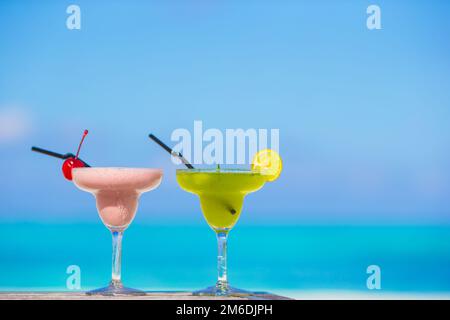 Two tasty cocktails on tropical white beach Stock Photo