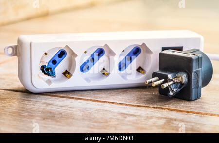 Electrical jolt for circuit breaker plug outlet zap need electricity maintenance fix by electrician artisan for renewal Stock Photo