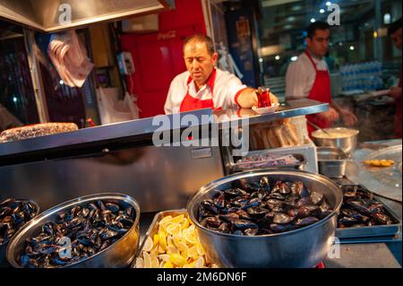 Famous Midye, Turkish stuffed mussels for sale in Balik Pasij on Istiklal street, Istanbul, Turkey, Stock Photo