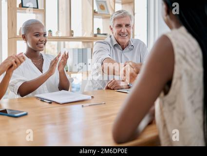 Business people, meeting and applause for handshake, ceo or black woman in office for promotion. Corporate team, shaking hands and congratulations for Stock Photo