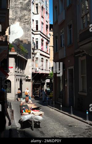 Traditional Turkish Eskici in Cihangir, the old man pushes a cart around the trendy Istanbul neighbo Stock Photo