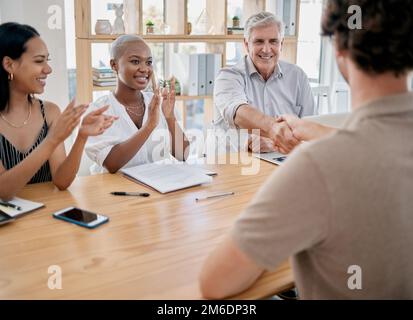 Business people, meeting and applause for handshake, ceo or black woman in office for promotion. Corporate team, shaking hands and congratulations for Stock Photo