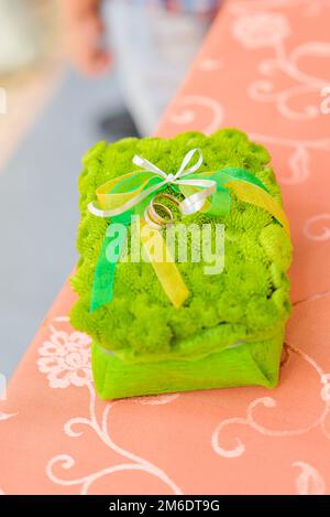 Flower pillow for wedding rings on the table Stock Photo