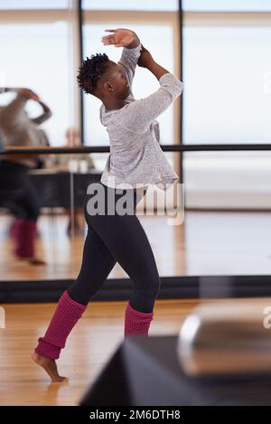 For the love of dancing. a young female dancer practicing in a dance studio. Stock Photo
