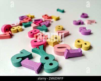 Children's colored letters placed on a white background. Stock Photo