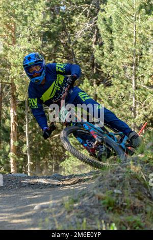 VALLNORD, ANDORRA  - JULY 4 2019:  CYCLIST in the MERCEDES-BENZ UCI MTB WORLD CUP 2018 - DHI Vallnor Stock Photo