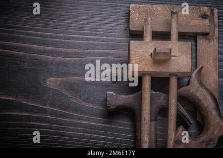 Composition of hand saw marking gauge claw hammer square ruler. Stock Photo