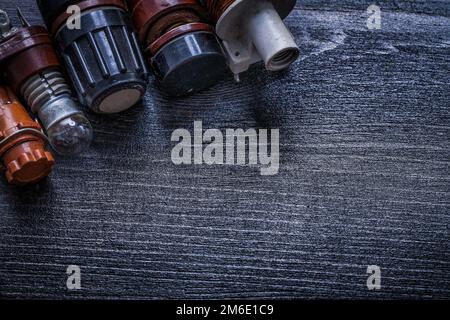 Composition of vintage electric tools on wooden board electricity concept. Stock Photo