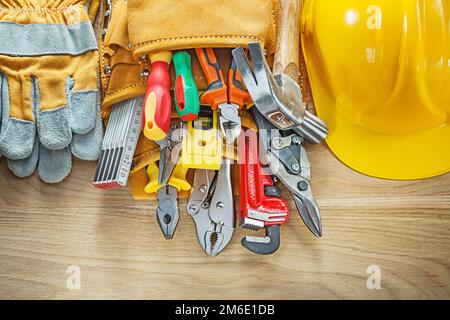 Construction tooling tool belt safety gloves hard hat. Stock Photo