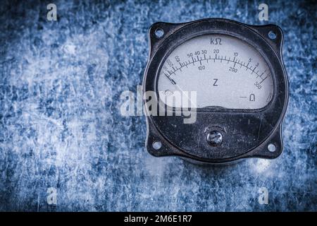 Electric instrument of measurement on metallic background vintage electricity concept. Stock Photo