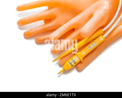 electrical tools dielectrical gloves and tester isolated on white Stock Photo
