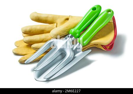 garden fork and hand spade on gloves isolated white Stock Photo