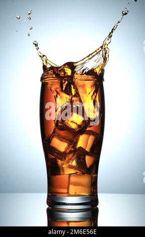 Cold Drink Splash with Ice Cubes Stock Photo - Alamy