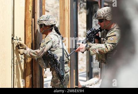 Soldiers with Company A, 52nd Brigade Engineer Battalion, 2nd Stryker Stryker Brigade Combat Team, 4th Infantry Division, prepare an explosive to breach a door during demolition training April 26 at Fort Carson, Colo. Squads from each platoon went over and refined their skills in breaching doors and clearing rooms using explosives. Stock Photo